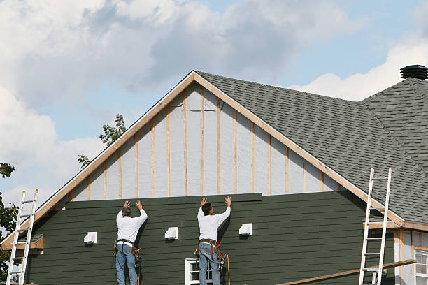 Professional Siding Contractor technician working in Brentwood, NY